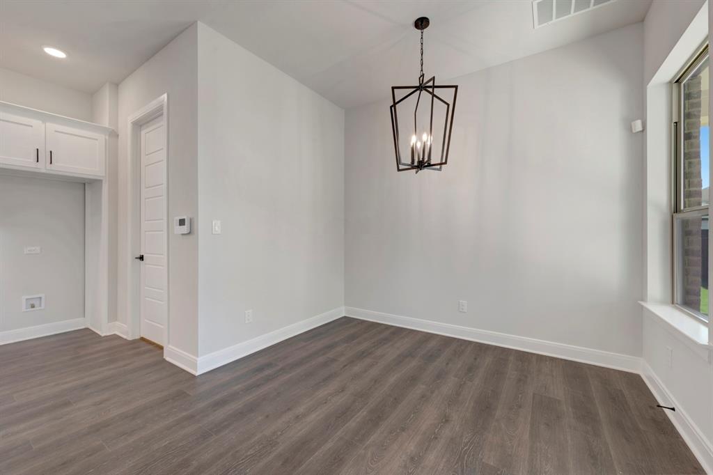 1857 Lightner Road Van Alstyne, TX 75495 - Photo 22 of 29 a view of empty room with wooden floor and window