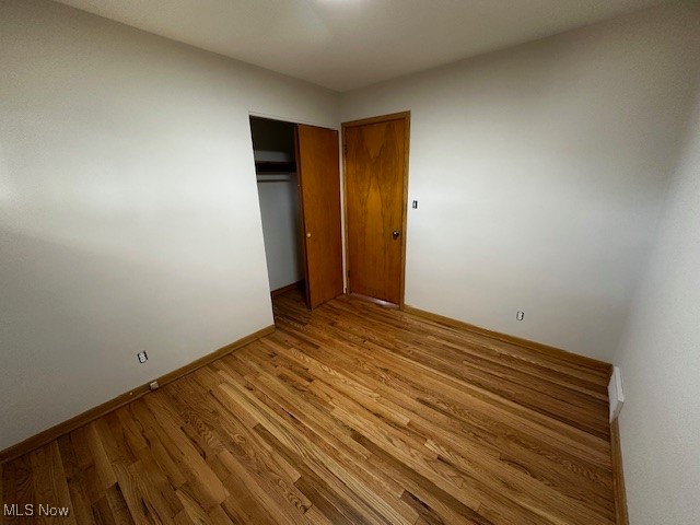 8375 Royal Ridge Drive Parma, OH 44129 - Photo 9 of 12 Unfurnished bedroom with wood finished floors and a closet