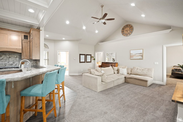 175 West 1000 North Mapleton, UT 84664 - Photo 9 of 42 Open-concept living space featuring a vaulted ceiling with a ceiling fan and recessed lighting