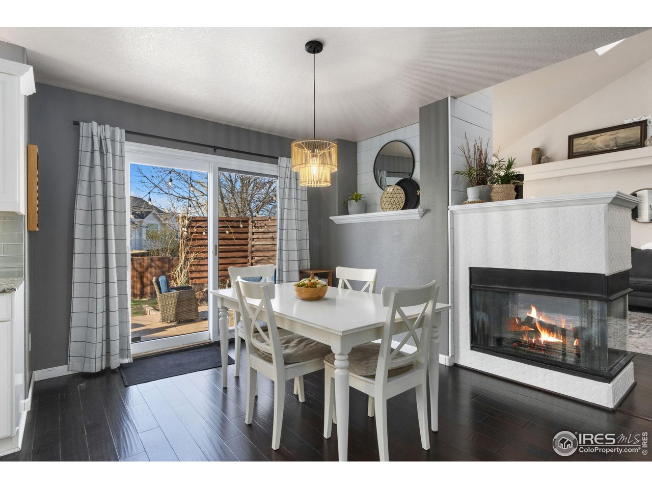 1808 Rolling Gate Road Fort Collins, CO 80526 - Photo 12 of 39 Eat in dining and 3 sided fireplace