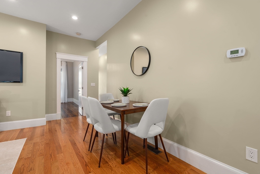 19 Pinckney Street, Unit 1 Somerville, MA 02145 - Photo 12 of 39 a view of a dining room with furniture and wooden floor