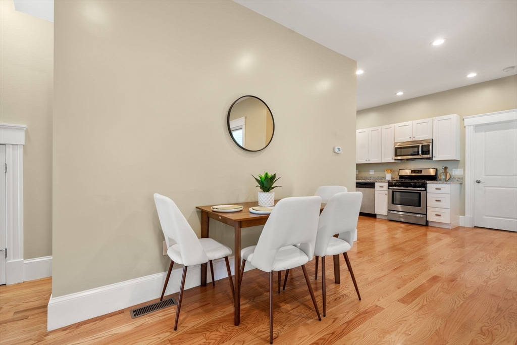 19 Pinckney Street, Unit 1 Somerville, MA 02145 - Photo 13 of 39 a dining room with furniture and wooden floor