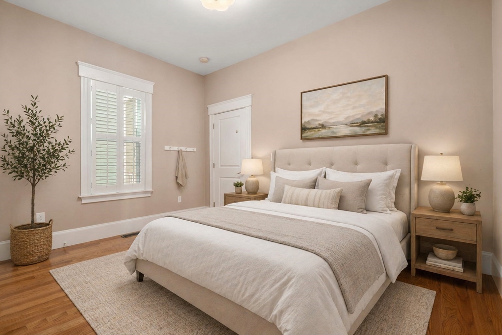 19 Pinckney Street, Unit 1 Somerville, MA 02145 - Photo 19 of 39 a bedroom with a bed and a window