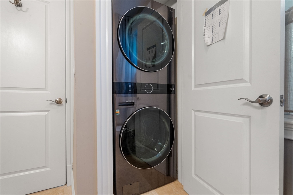 19 Pinckney Street, Unit 1 Somerville, MA 02145 - Photo 24 of 39 a utility room with dryer and washer