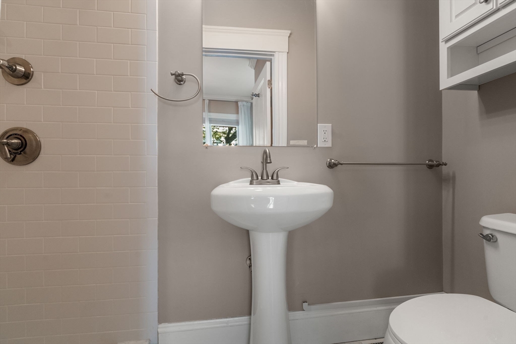 19 Pinckney Street, Unit 1 Somerville, MA 02145 - Photo 30 of 39 a bathroom with a sink toilet and shower