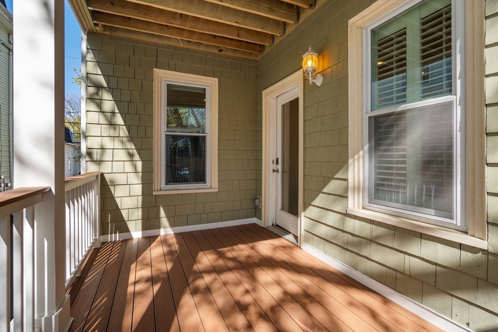 19 Pinckney Street, Unit 1 Somerville, MA 02145 - Photo 32 of 39 a view of a balcony with a lounge chair