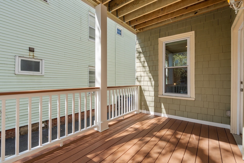 19 Pinckney Street, Unit 1 Somerville, MA 02145 - Photo 33 of 39 a view of a brick house with wooden floor