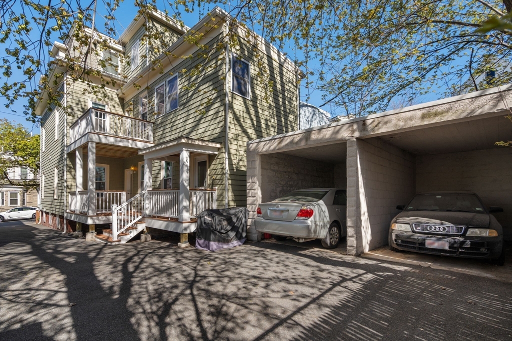 19 Pinckney Street, Unit 1 Somerville, MA 02145 - Photo 36 of 39 a car parked in front of a house