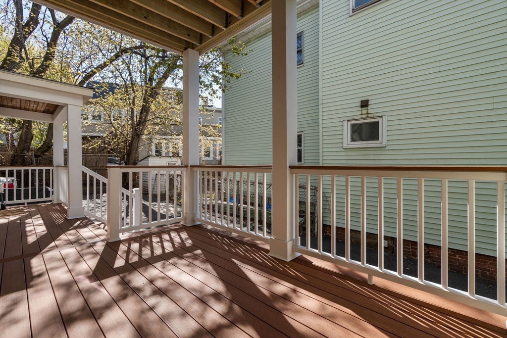 19 Pinckney Street, Unit 1 Somerville, MA 02145 - Photo 6 of 39 a view of a balcony with wooden floor
