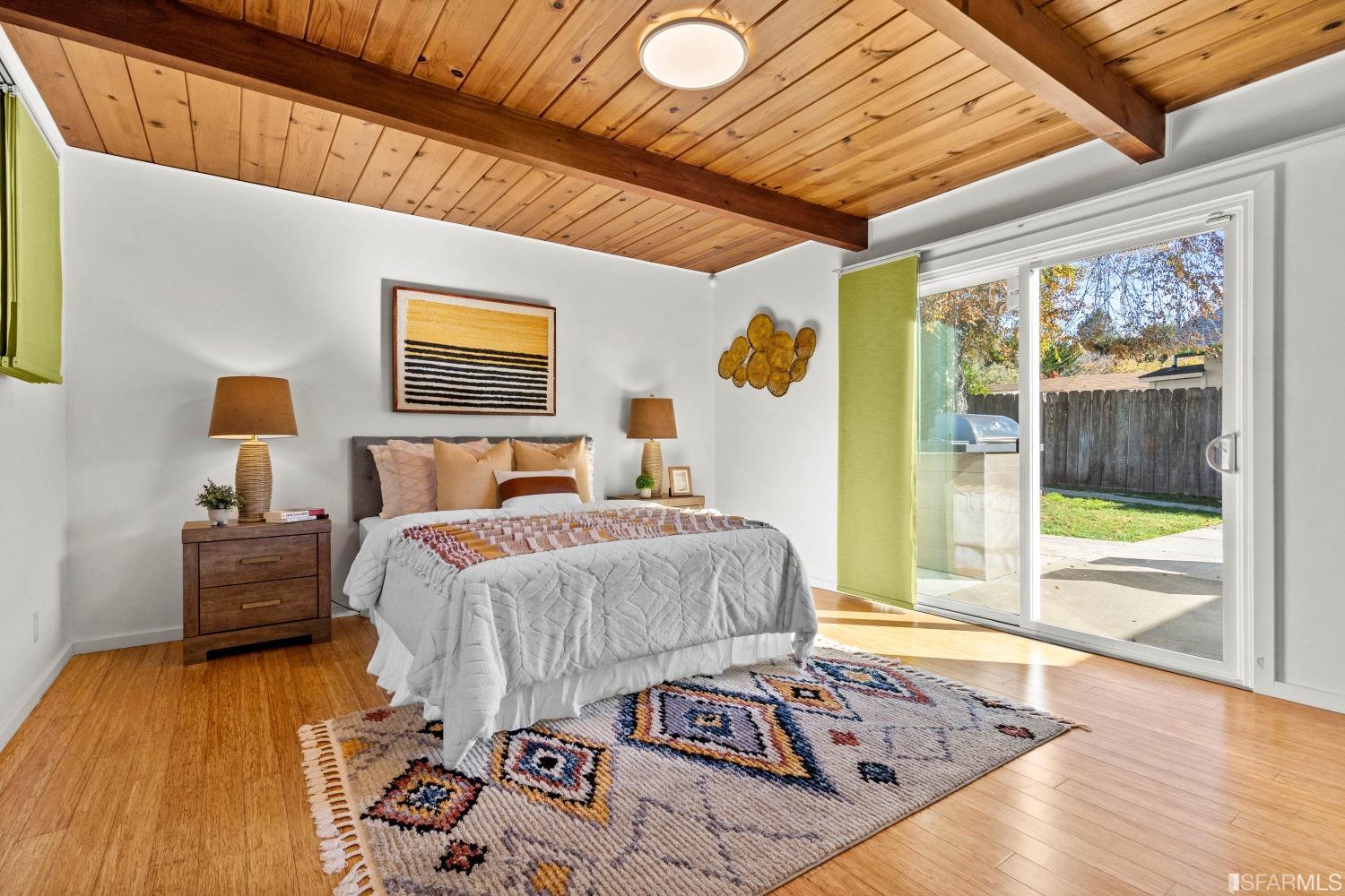 1854 Key Boulevard El Cerrito, CA 94530 - Photo 28 of 43 a bedroom with a bed and wooden floor