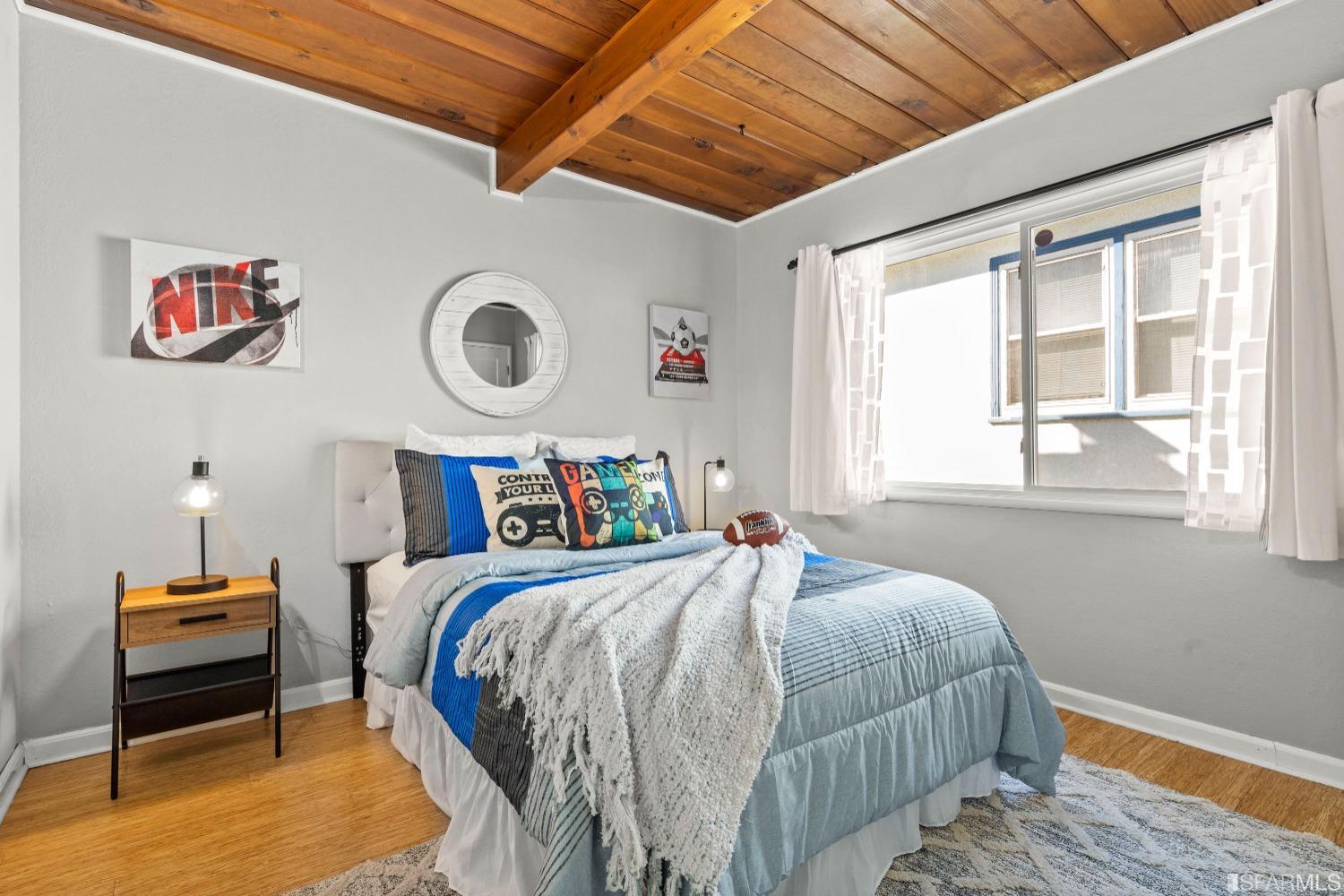 1854 Key Boulevard El Cerrito, CA 94530 - Photo 32 of 43 a bedroom with a bed and a window