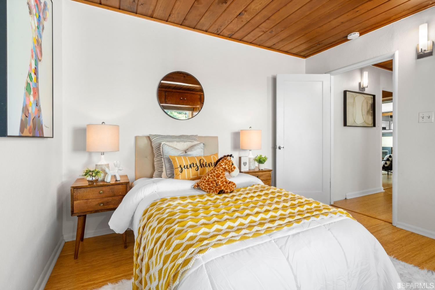 1854 Key Boulevard El Cerrito, CA 94530 - Photo 39 of 43 a bedroom with a bed and a lamp on dresser