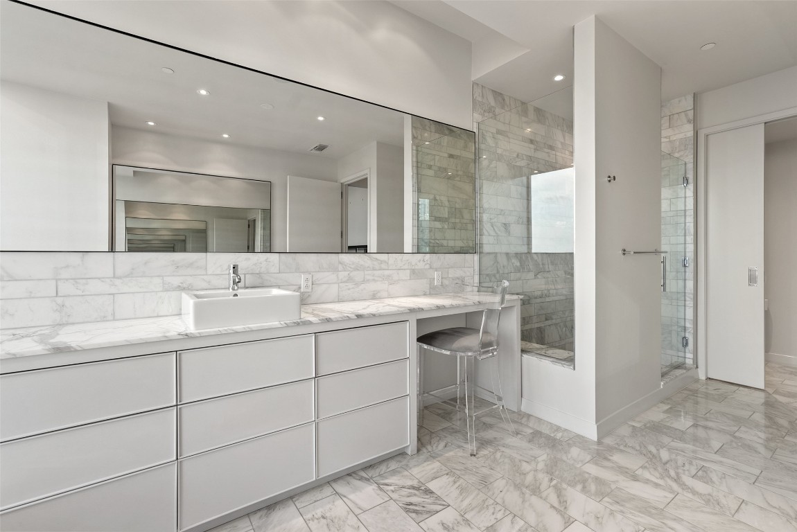 210 Lavaca Street, Unit 2505 Austin, TX 78701 - Photo 12 of 40 a bathroom with a sink and a mirror