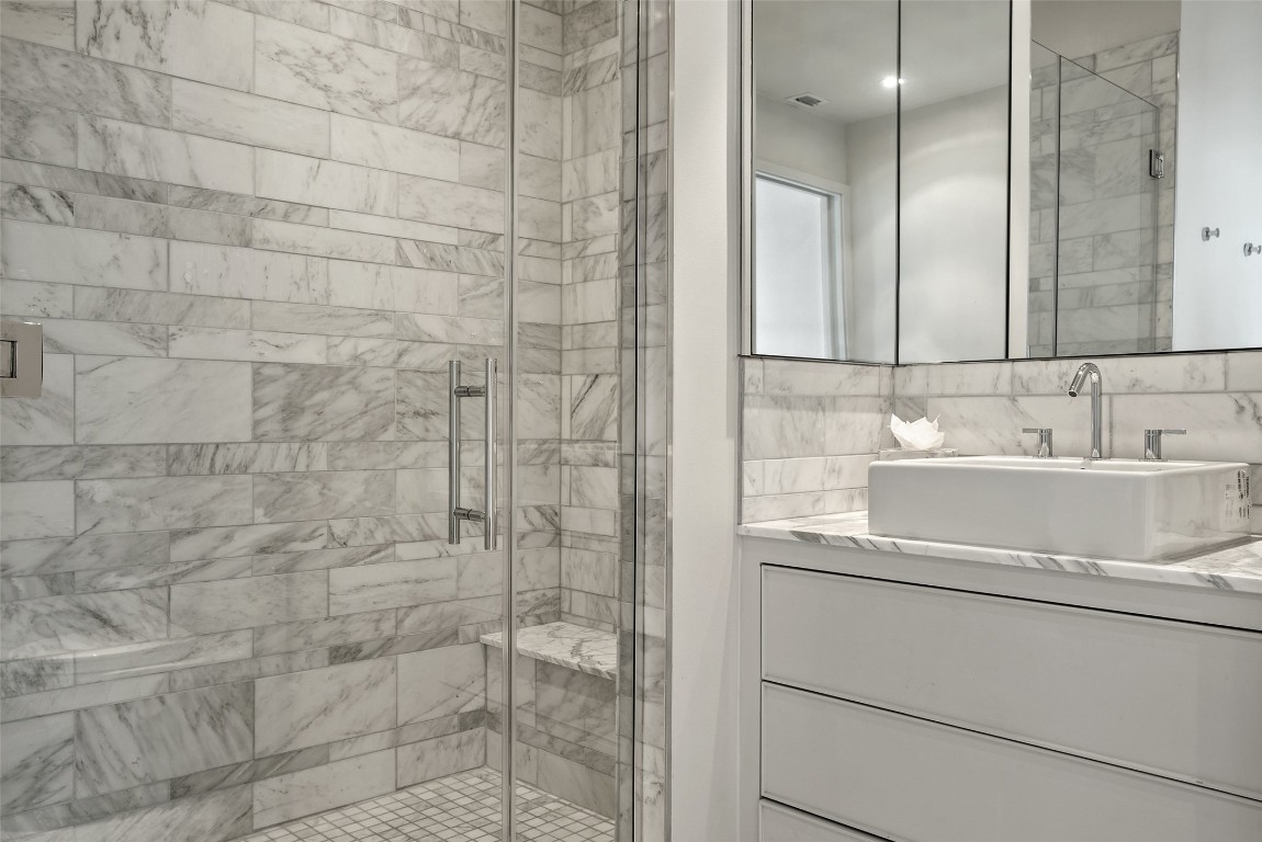 210 Lavaca Street, Unit 2505 Austin, TX 78701 - Photo 17 of 40 a bathroom with a sink and a mirror