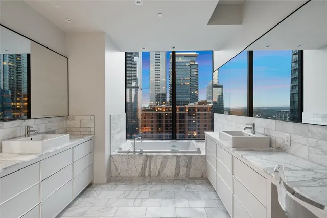 a bathroom with a sink and a large mirror