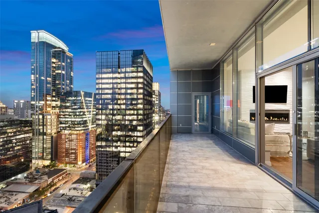 a view of balcony with wooden floor