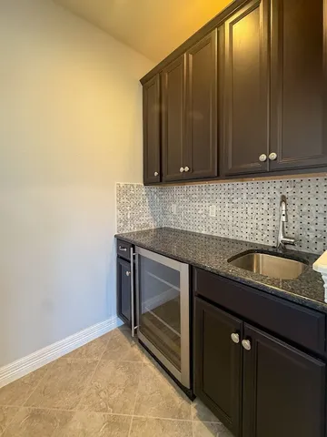 a kitchen with a sink cabinets and utility