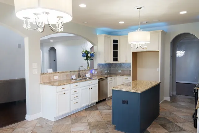 a large kitchen with a large island in it