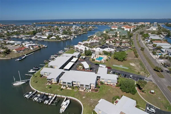 an aerial view of a house with a ocean view