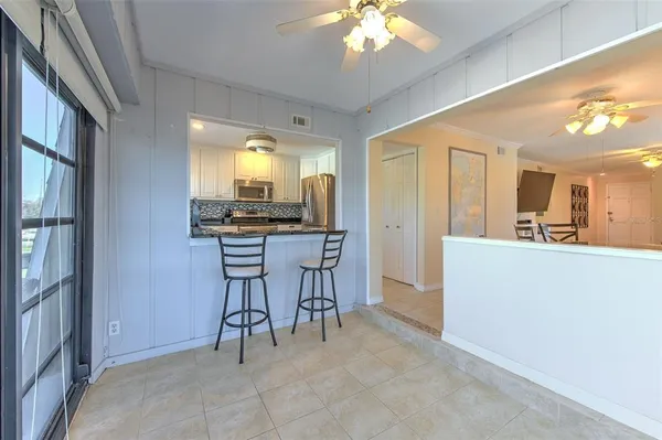 a kitchen with a refrigerator stove and sink
