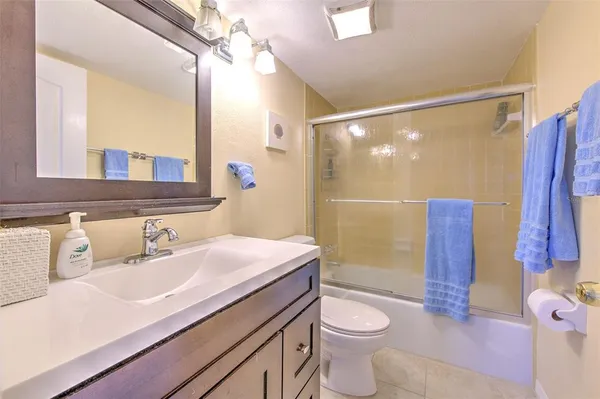 a bedroom with a bed and a dresser in it