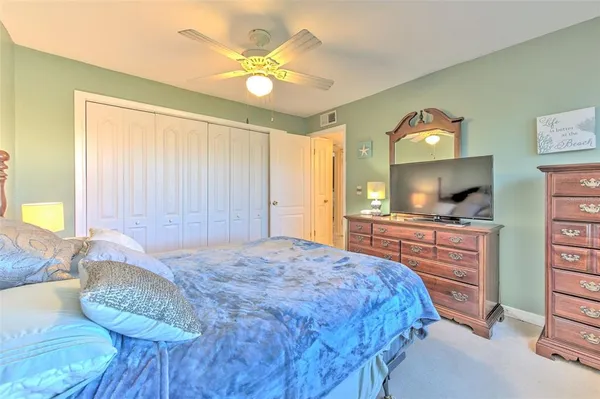 a living room with a bed furniture and a large window