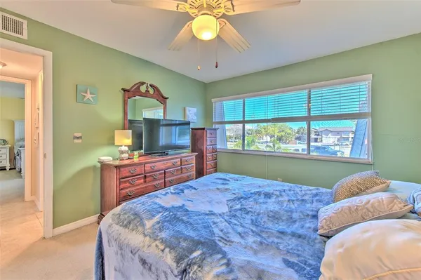 a view of a sign board in a yard with plants