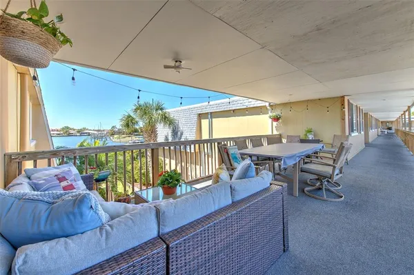 a view of a porch with chairs and backyard