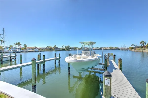 an aerial view of a house with a ocean view