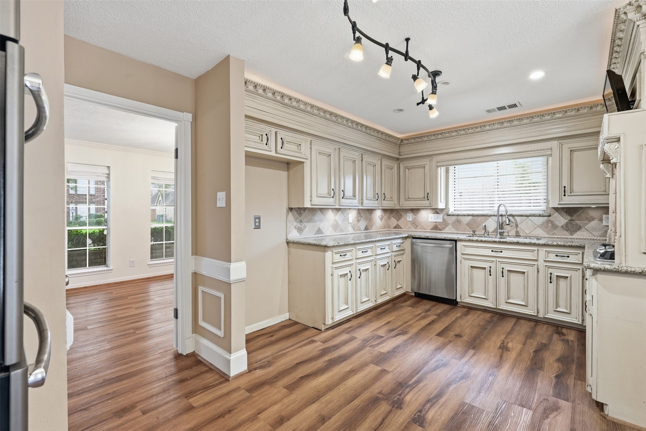 8310 Mentmore Drive Spring, TX 77379 - Photo 18 of 47 Thoughtfully designed with ample workspace and storage, this kitchen is ready for gatherings of every size.