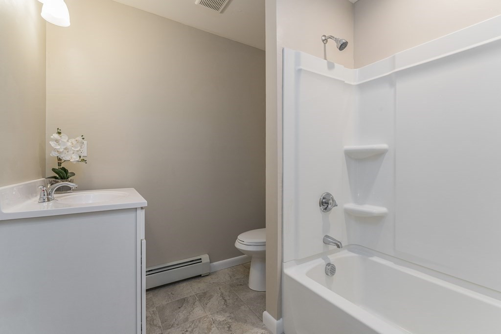 20 Laurelwood Road Rutland, MA 01543 - Photo 11 of 31 a white bath tub sitting next to a white toilet