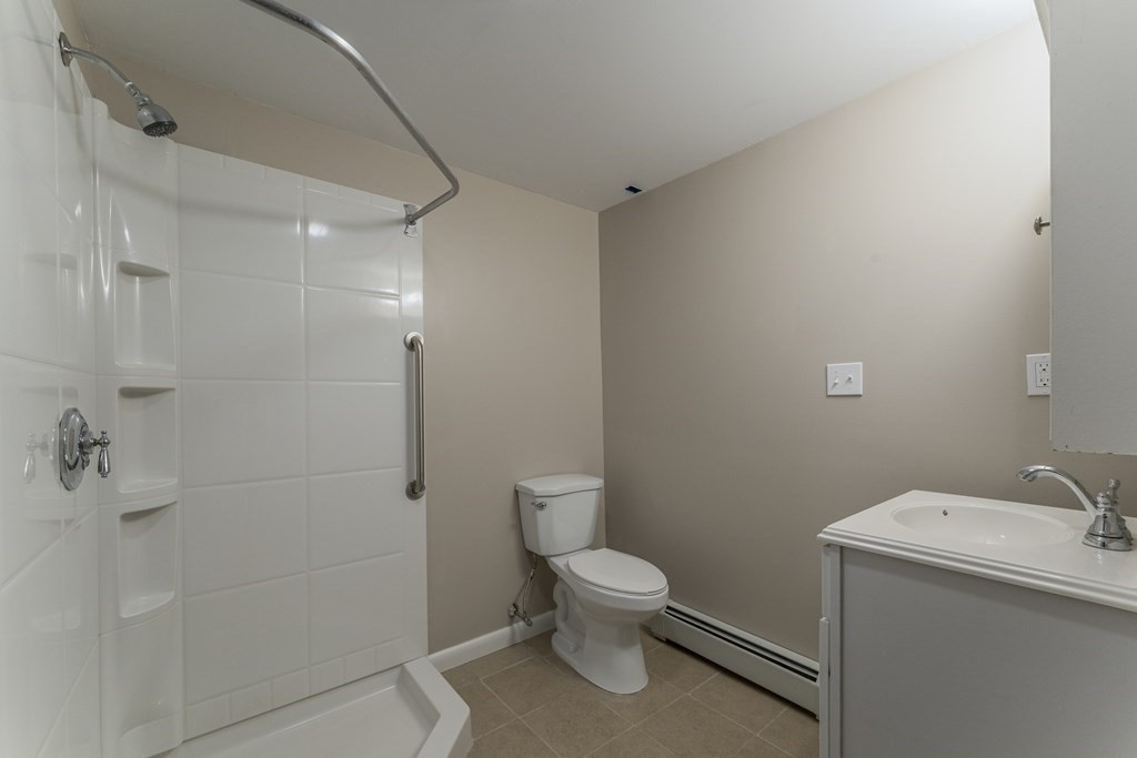 20 Laurelwood Road Rutland, MA 01543 - Photo 18 of 31 a white toilet sitting next to a bathroom sink