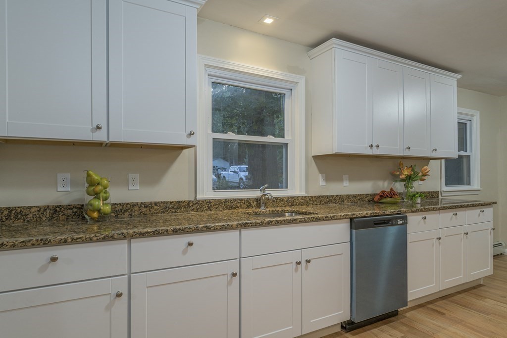 20 Laurelwood Road Rutland, MA 01543 - Photo 4 of 31 a kitchen with granite countertop stainless steel appliances white cabinets granite counter tops and a sink
