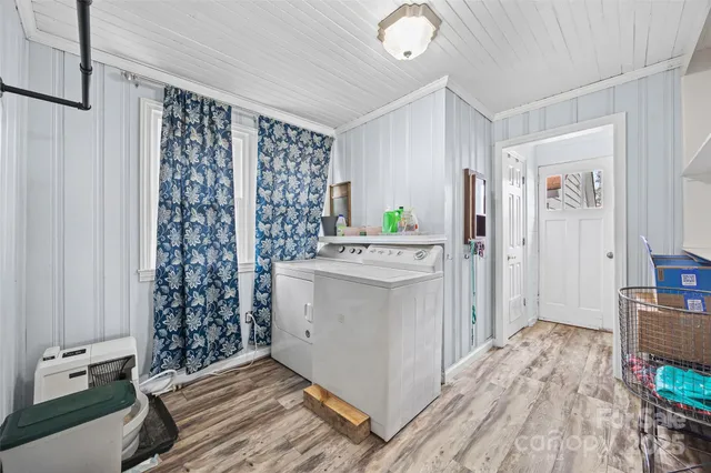 a kitchen with a refrigerator and a stove