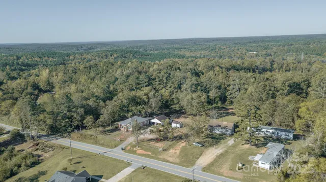 a view of a field with an trees