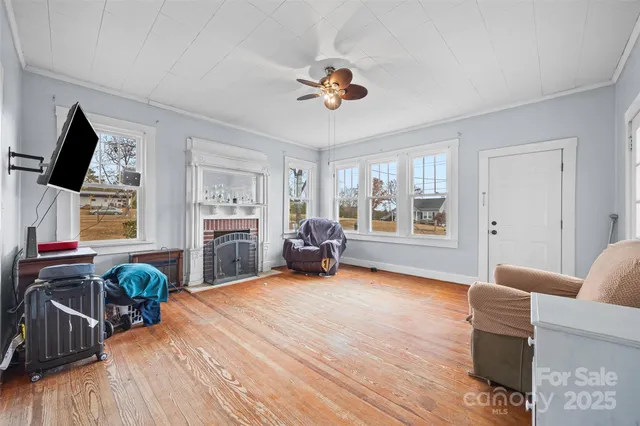 a bed room with furniture and a flat screen tv