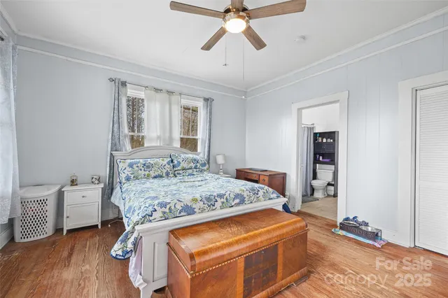 a bed room with a bed and a chandelier