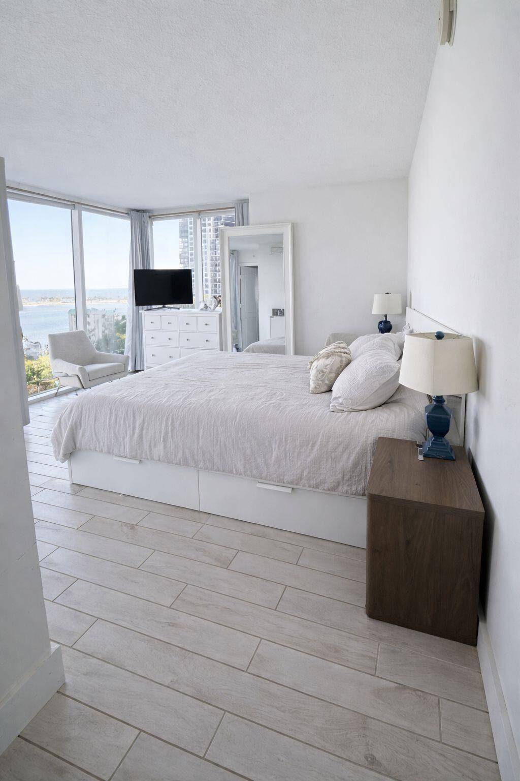 2101 Brickell Avenue, Unit 507 Miami, FL 33129 - Photo 13 of 25 a large bedroom with a bed and a large window