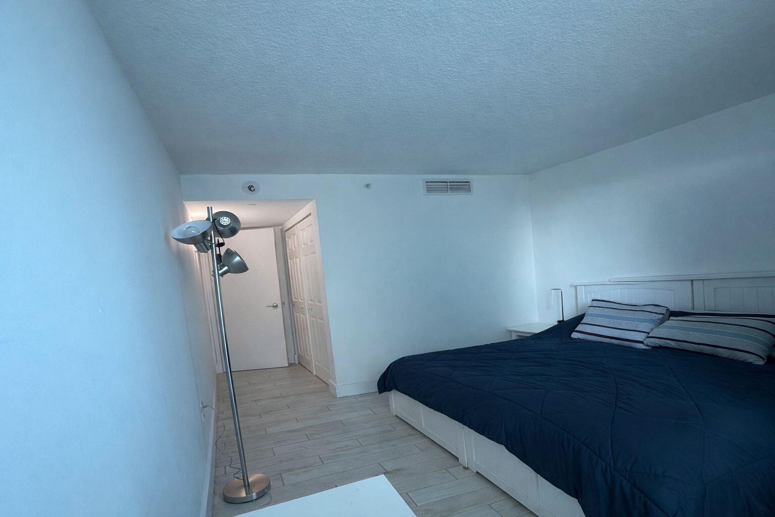 2101 Brickell Avenue, Unit 507 Miami, FL 33129 - Photo 19 of 25 a bedroom with a bed and a view of bathroom