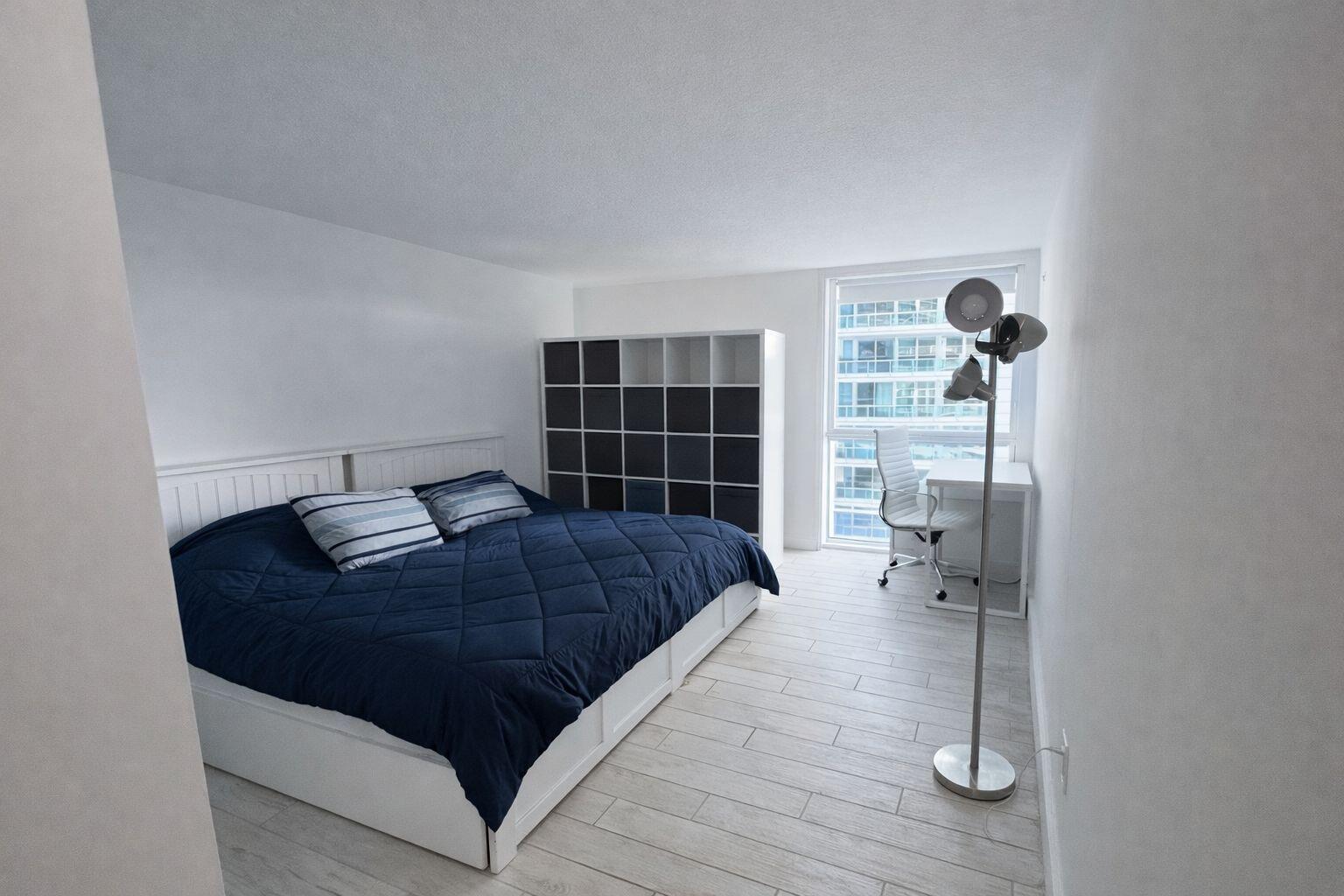 2101 Brickell Avenue, Unit 507 Miami, FL 33129 - Photo 20 of 25 a bedroom with a bed and window