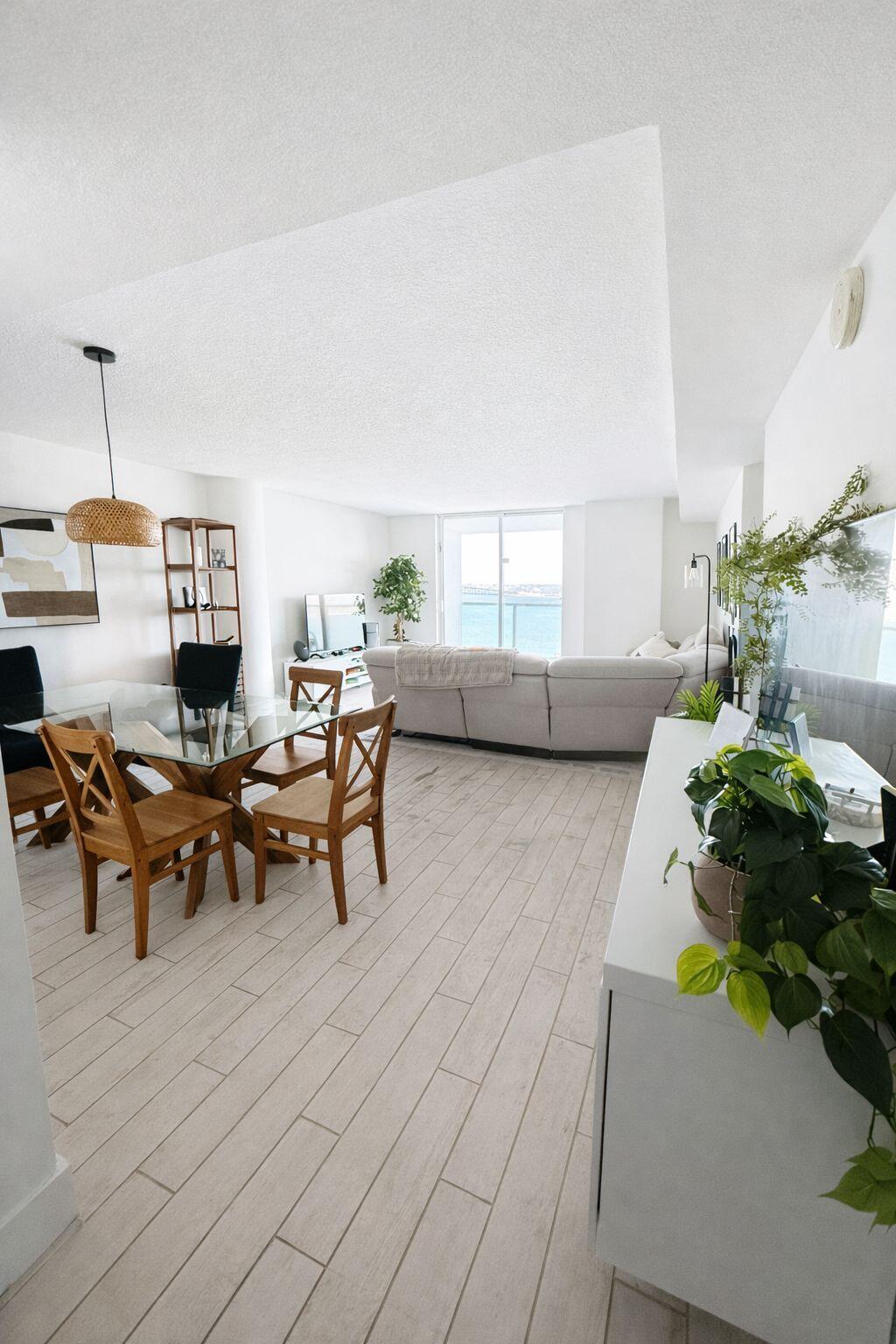 2101 Brickell Avenue, Unit 507 Miami, FL 33129 - Photo 5 of 25 a living room with furniture and a potted plant