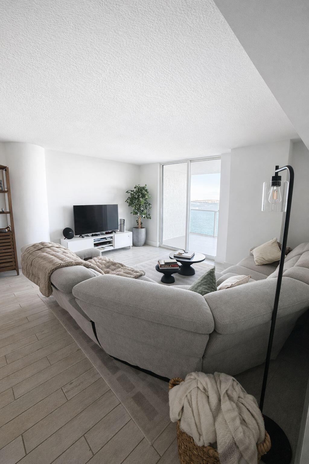 2101 Brickell Avenue, Unit 507 Miami, FL 33129 - Photo 9 of 25 a living room with a bed furniture and a window