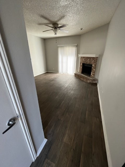 Undisclosed Address Corpus Christi, TX 78413 - Photo 2 of 11 a view of empty room with wooden floor and fan