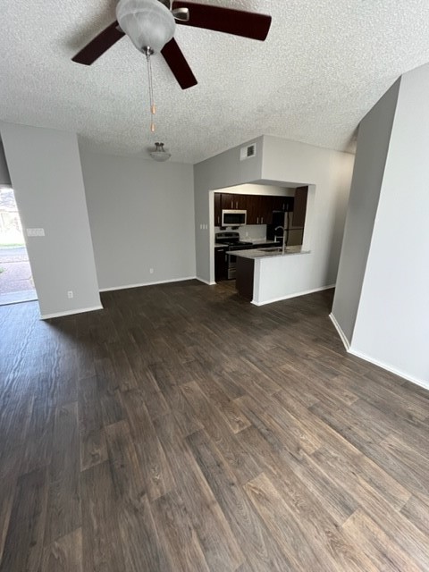 Undisclosed Address Corpus Christi, TX 78413 - Photo 3 of 11 a view of an empty room with wooden floor ceiling fan