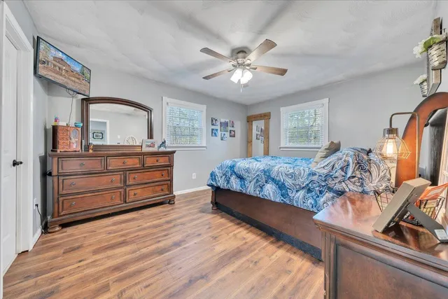 a bedroom with a bed and a dresser