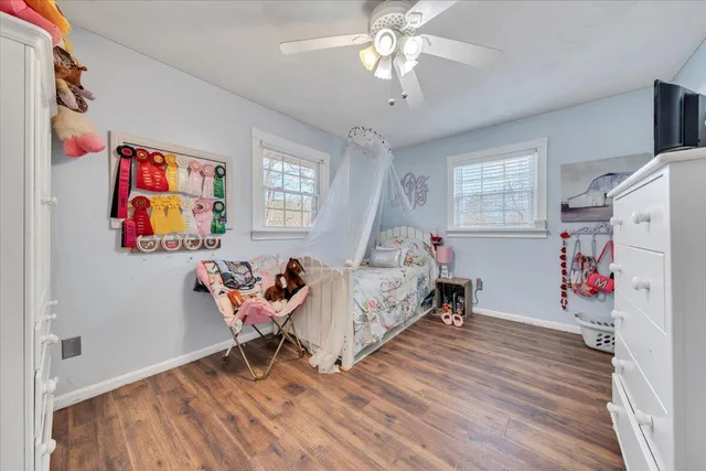 a bed room with a bed and a chandelier