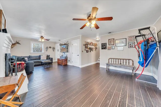 a view of a livingroom with furniture and hardwood floor