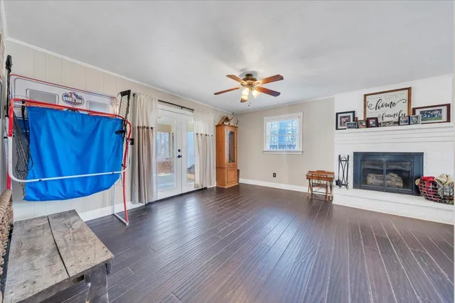 a view of a livingroom with furniture and a fireplace