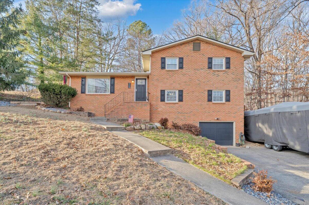2166 Ruritan Road Roanoke, VA 24012 - Photo 3 of 46 a front view of a house with a yard