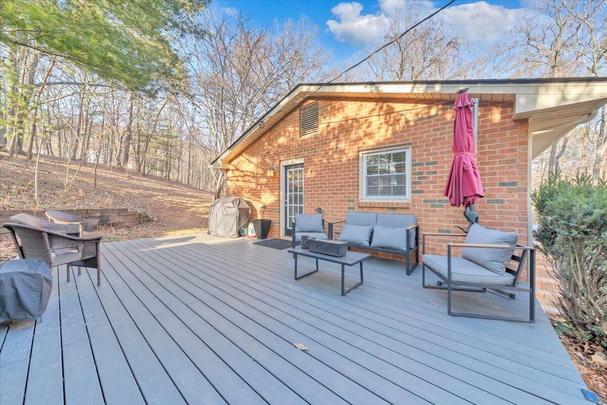 2166 Ruritan Road Roanoke, VA 24012 - Photo 44 of 46 a backyard of a house with wooden floor and outdoor seating